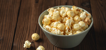 popcorn stuck in his teeth